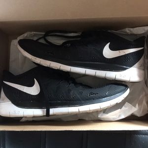 Black and white Nike free runs